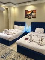 Postel nebo postele na pokoji v ubytování Pyramids Haven Hotel