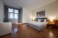 Łóżko lub łóżka w pokoju w obiekcie iH Hotels Milano Eur - Trezzano sul Naviglio