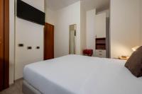 Łóżko lub łóżka w pokoju w obiekcie iH Hotels Milano Eur - Trezzano sul Naviglio