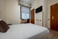Łóżko lub łóżka w pokoju w obiekcie iH Hotels Milano Eur - Trezzano sul Naviglio