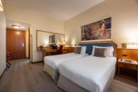 Łóżko lub łóżka w pokoju w obiekcie iH Hotels Milano Eur - Trezzano sul Naviglio