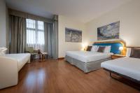 Łóżko lub łóżka w pokoju w obiekcie iH Hotels Milano Eur - Trezzano sul Naviglio