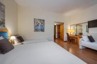Łóżko lub łóżka w pokoju w obiekcie iH Hotels Milano Eur - Trezzano sul Naviglio