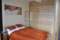 Posteľ alebo postele v izbe v ubytovaní Olympic Park Apartment