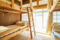 Masukichi -hostel,cafe,souvenir,guide-にあるベッド