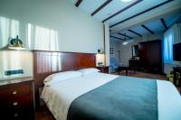 Posteľ alebo postele v izbe v ubytovaní Hotel Tharsis