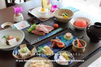 a table topped with different types of food on plates at Seven Colors Ishigakijima in Ishigaki Island