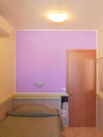 A bed or beds in a room at Hotel Arco Romana