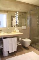 a bathroom with a toilet and a sink and a shower at Villa Spalletti Trivelli - Small Luxury Hotels of the World in Rome