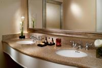 a bathroom with two sinks and a large mirror at Orlando World Center Marriott in Orlando