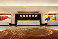 a lobby with a large rug on the floor at Le Meridien Coimbatore in Coimbatore