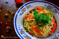 a bowl of noodles with vegetables on a table at Casa de Oaspeți Sfântul Nicolae in Iaşi