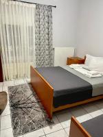 Posteľ alebo postele v izbe v ubytovaní Guesthouse Tsoka