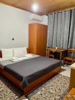 Posteľ alebo postele v izbe v ubytovaní Guesthouse Tsoka