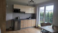 Kuchyňa alebo kuchynka v ubytovaní Apartamenty Majer Łeba
