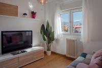 Televízia a/alebo spoločenská miestnosť v ubytovaní MRS Apartamento vistas Sierra Nevada con parking