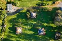 an overhead view of a garden with three domes at Yourtes Olachat proche Annecy in Faverges