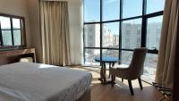 سمت ان النرجس للشقق المخدومة - Samt Inn Al Narjis Serviced Apartmentsにあるベッド