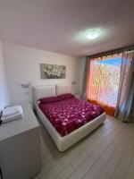 Posteľ alebo postele v izbe v ubytovaní Villetta Ulivi CA7 sun terrace by Gardadomusmea