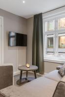 TV a/nebo společenská místnost v ubytování Forenom Serviced Apartments Oslo Opera