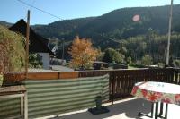 a balcony with a table and a view of a mountain at Gasthof Holländer Eck in Lennestadt