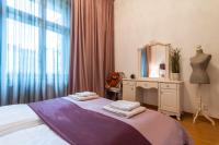 Postel nebo postele na pokoji v ubytování Staropramenna Garden Residence