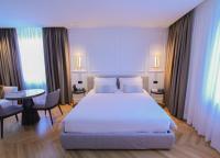 Posteľ alebo postele v izbe v ubytovaní Ambassador Palace Hotel