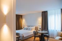 Posteľ alebo postele v izbe v ubytovaní Ambassador Palace Hotel