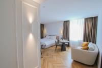 Posteľ alebo postele v izbe v ubytovaní Ambassador Palace Hotel
