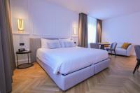 Posteľ alebo postele v izbe v ubytovaní Ambassador Palace Hotel