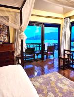 Postel nebo postele na pokoji v ubytování Cinnamon Beach Villas