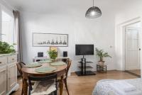 A television and/or entertainment centre at House of Happy Hours With TERRACE
