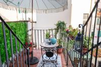 A balcony or terrace at House of Happy Hours With TERRACE