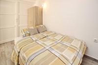 Postel nebo postele na pokoji v ubytování Apartments Vasilic-Cugalj-Smokvina