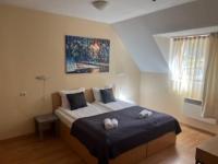 Postel nebo postele na pokoji v ubytování Minkov Apartments, Замъка 2