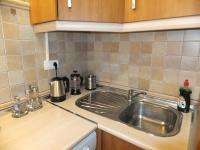 Kuchyňa alebo kuchynka v ubytovaní Apartamento Bahia Dorada