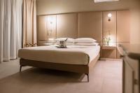 Posteľ alebo postele v izbe v ubytovaní Le Greghe Suites