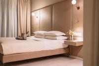Posteľ alebo postele v izbe v ubytovaní Le Greghe Suites