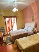 A bed or beds in a room at Hotel Aoos