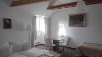 Postel nebo postele na pokoji v ubytování Penzion Nad Kašnou