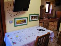 A television and/or entertainment centre at Diving Center Punta Stilo
