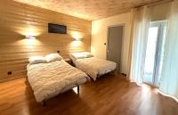 Posteľ alebo postele v izbe v ubytovaní L'AIGLON appartement