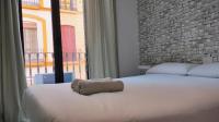 Postel nebo postele na pokoji v ubytování Apartamento en Sevilla Centro con Vistas a la Plaza Alameda de Hércules - Hasta 7 personas
