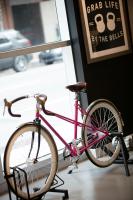 a pink bike parked in front of a window at MOXY New Orleans Downtown/French Quarter Area in New Orleans