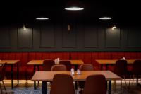 a dining room with wooden tables and chairs at Gоderdzi Twins Hotel in Goderdzi