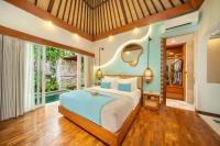 Aksari Villa Seminyak by Ini Vie Hospitalityにあるベッド