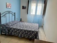 A bed or beds in a room at Costa Gaia Rooms