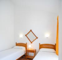 Postel nebo postele na pokoji v ubytování Bungalows Las Almenas