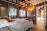 A bed or beds in a room at SevillaHome- Ave Cesar