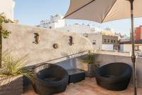 A balcony or terrace at SevillaHome- Ave Cesar